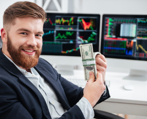 A businessman holding cash
