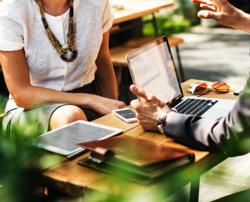 A businessman presenting funding strategy to a woman