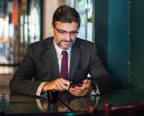 A businessman checking cellphone