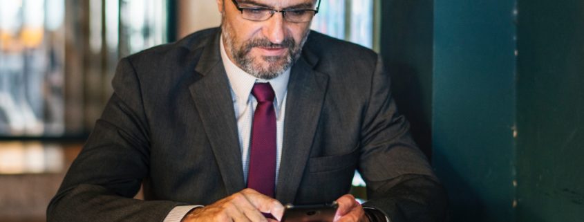 A businessman checking cellphone