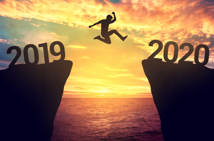 Businessman jump between 2019 and 2020 years. Business Growth Strategies